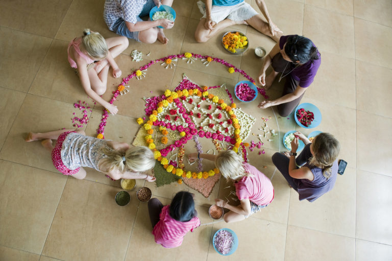 Auroville children designing a flower mandala, 2016