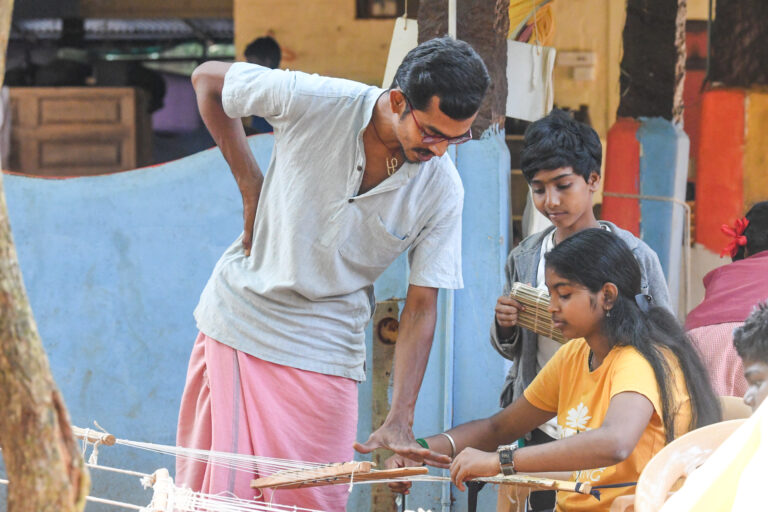 children weaving at the ECM 2026